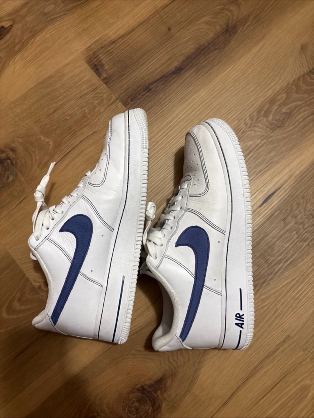 Nike White Sneakers with Navy Blue Swoosh